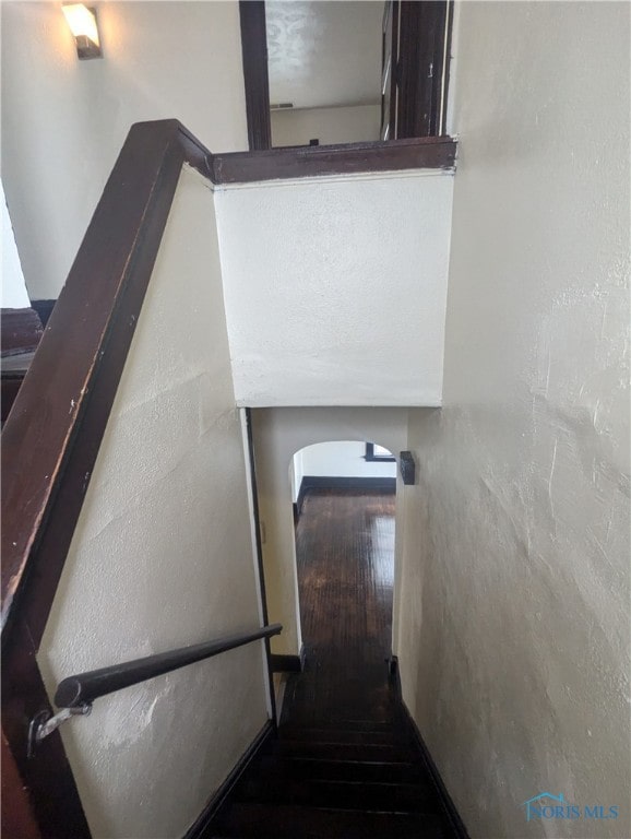 stairway featuring hardwood / wood-style floors