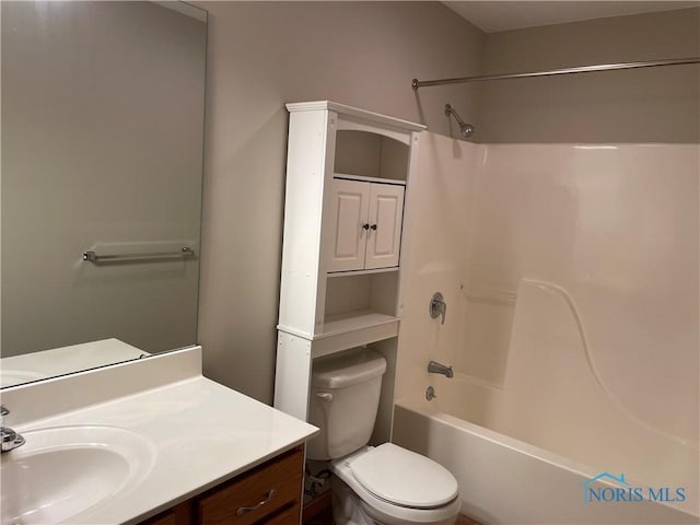 full bathroom with toilet, vanity, and shower / tub combination