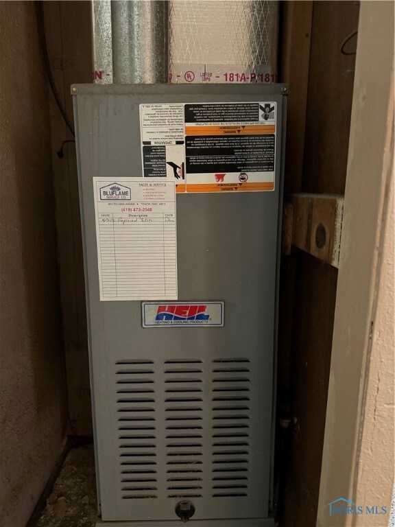 utility room with heating unit