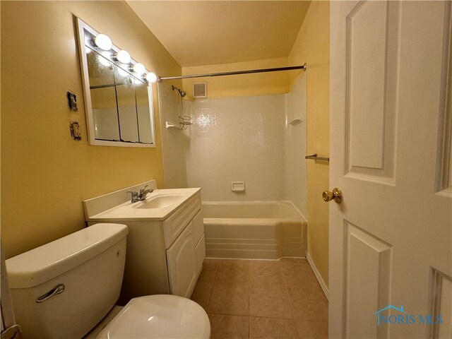 full bathroom with tile patterned flooring, washtub / shower combination, vanity, and toilet