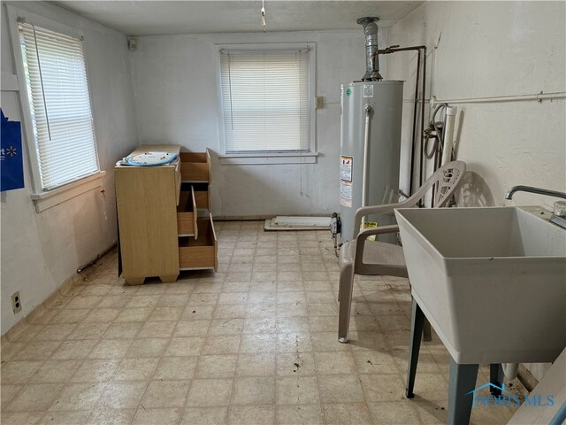 utility room featuring gas water heater