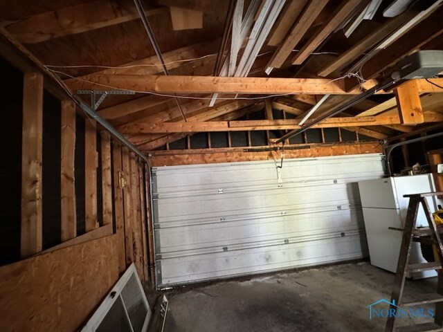 garage with white refrigerator