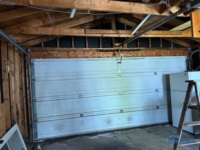 garage with wood walls