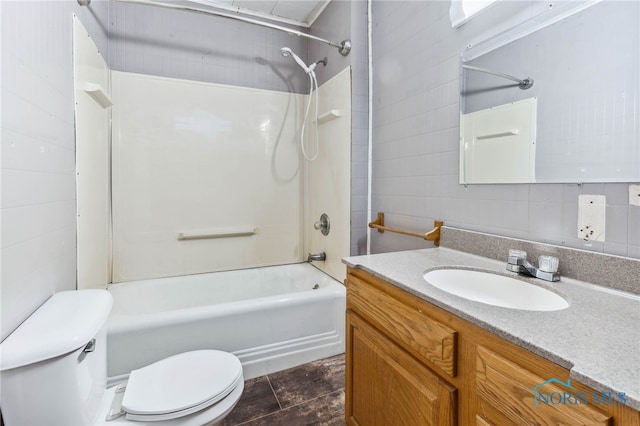 full bathroom featuring tile patterned flooring, vanity, shower / bathing tub combination, toilet, and decorative backsplash