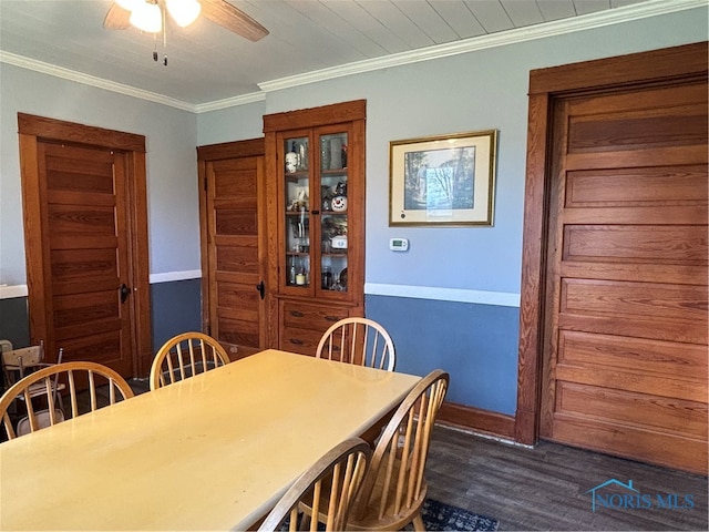 dining space featuring ceiling fan, dark hardwood / wood-style flooring, and ornamental molding