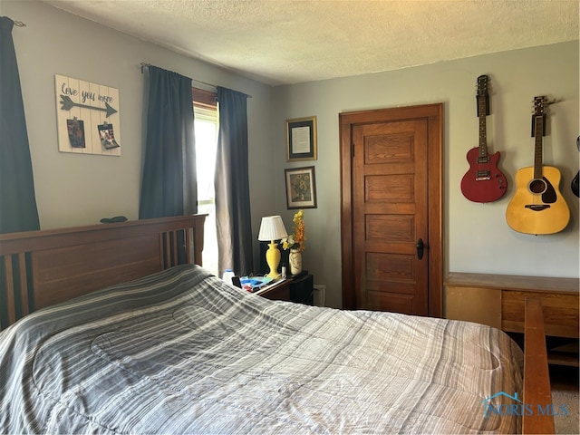 bedroom featuring a textured ceiling