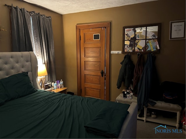 bedroom featuring a textured ceiling