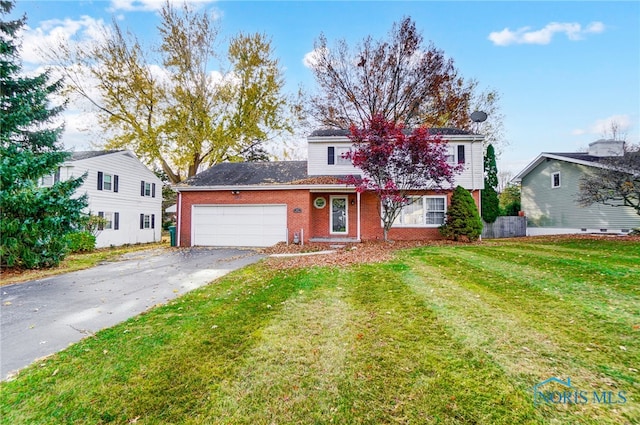 view of front property featuring a garage and a front yard