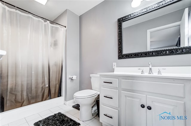 bathroom with toilet, vanity, tile patterned floors, and a shower with shower curtain