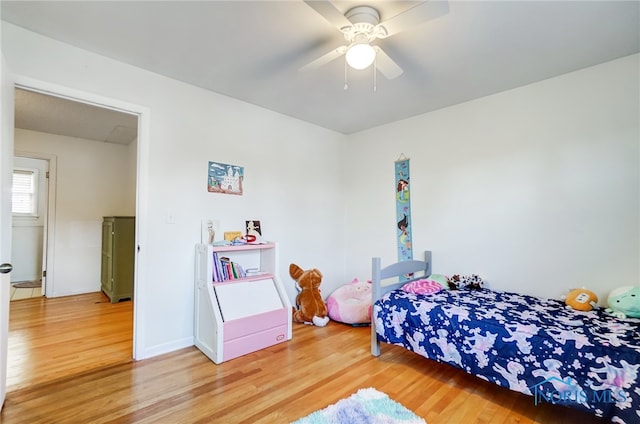 bedroom with ceiling fan and wood-type flooring