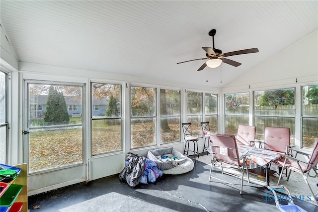 sunroom / solarium featuring lofted ceiling and ceiling fan