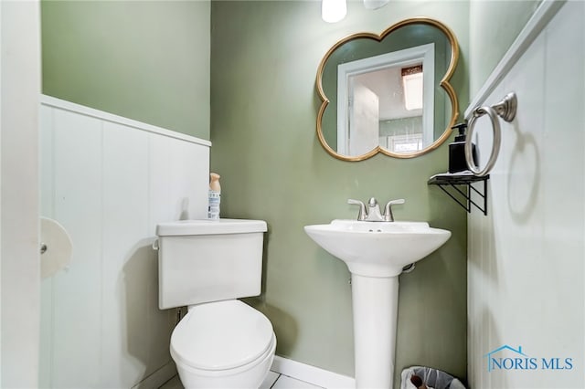 bathroom featuring tile patterned floors and toilet