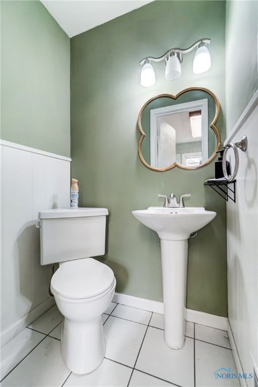 bathroom featuring tile patterned flooring and toilet