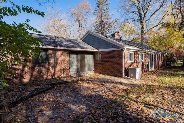 view of side of home with cooling unit