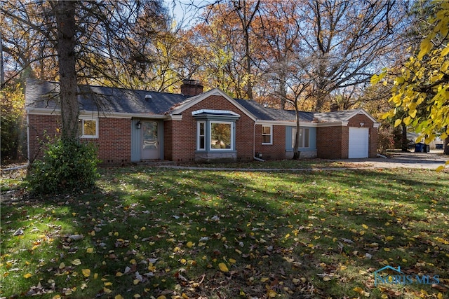 ranch-style house with a garage and a front yard