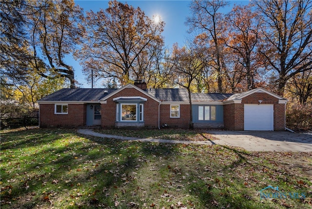 single story home featuring a garage and a front yard