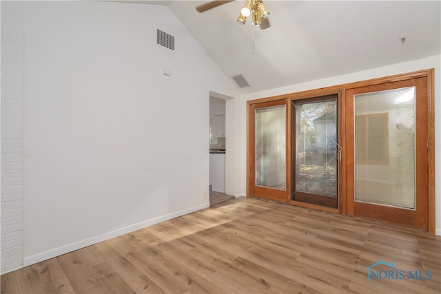 unfurnished room with high vaulted ceiling, light wood-type flooring, and ceiling fan