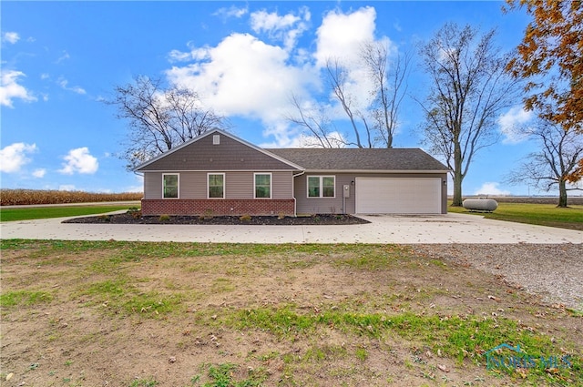 single story home featuring a garage and a front lawn