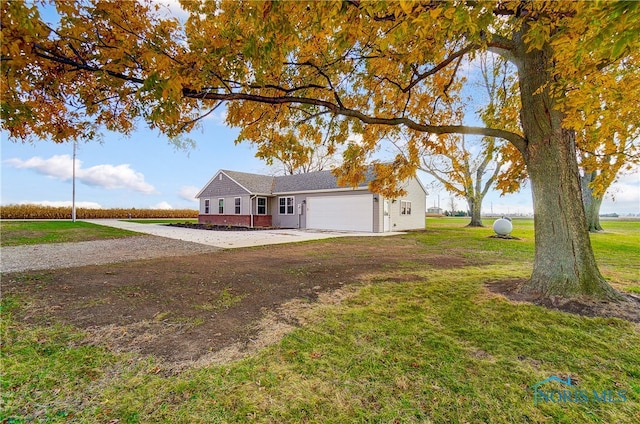 ranch-style home with a front lawn and a garage