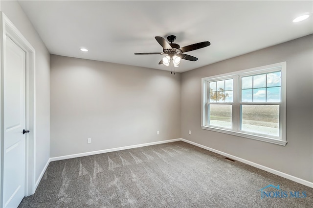 carpeted empty room with ceiling fan