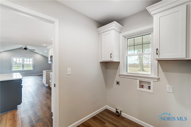 laundry room featuring ceiling fan, cabinets, washer hookup, hookup for an electric dryer, and dark hardwood / wood-style flooring