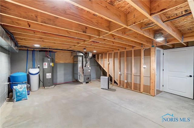 basement with electric water heater and heating unit