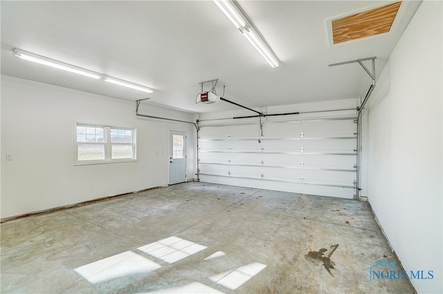 garage featuring a garage door opener