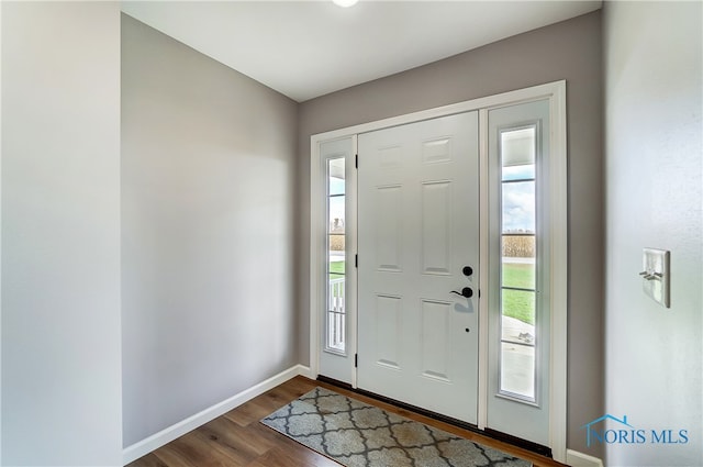 foyer with dark hardwood / wood-style floors