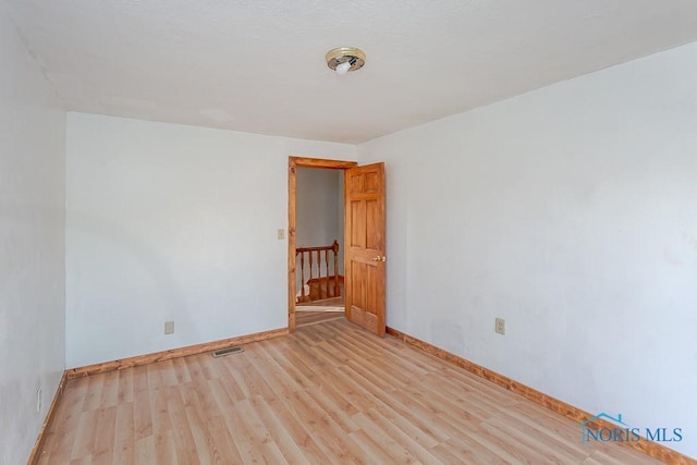 empty room with light wood-type flooring