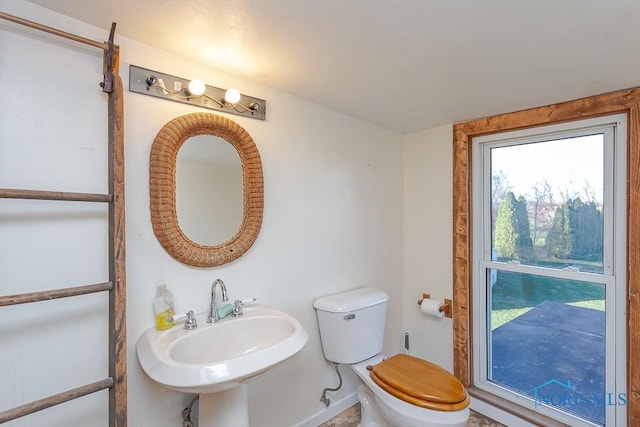 bathroom featuring toilet and sink