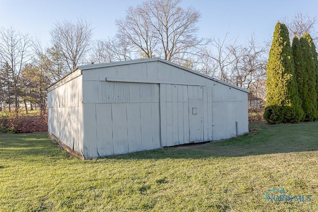 view of outdoor structure with a yard