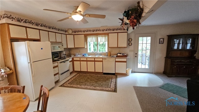 kitchen featuring ceiling fan, white appliances, cream cabinetry, and sink