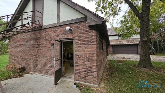 view of side of property with a garage