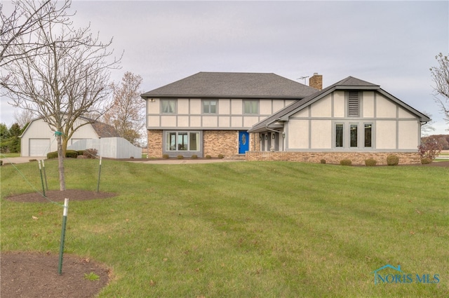 view of front facade featuring a front yard and a garage