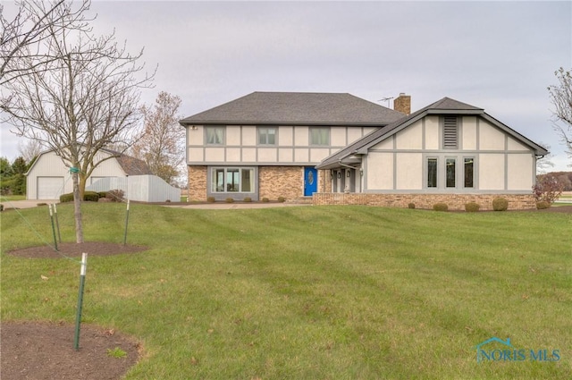 7733 Brown Rd, Curtice, OH 43412 - tudor house with a chimney and stucco siding