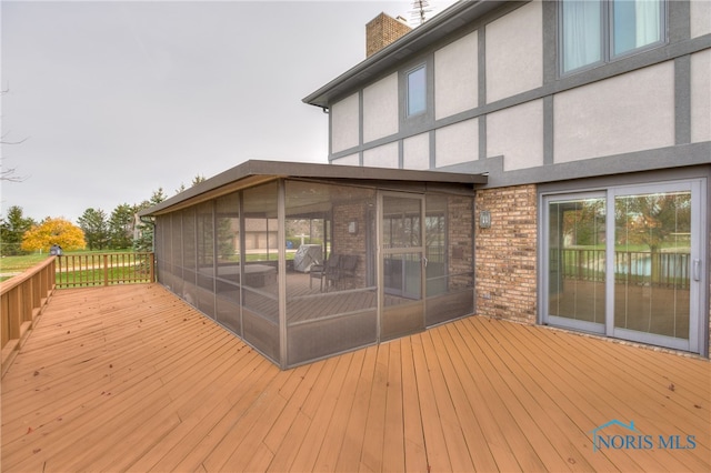 deck featuring a sunroom