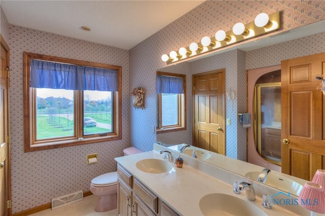 7733 Brown Rd, Curtice, OH 43412 - full bath featuring an enclosed shower, toilet, double vanity, and wallpapered walls