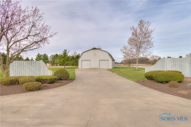 garage featuring a lawn