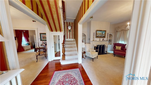 foyer featuring radiator and wood-type flooring