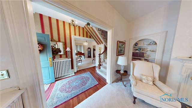 interior space with hardwood / wood-style floors and a chandelier