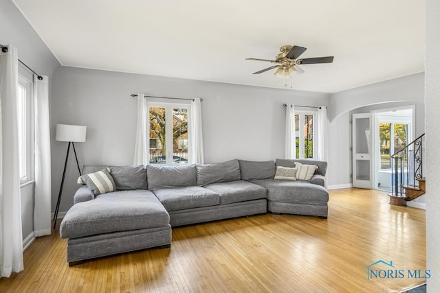 living room featuring plenty of natural light, hardwood / wood-style flooring, and ceiling fan