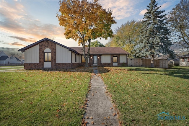 view of front of home with a yard