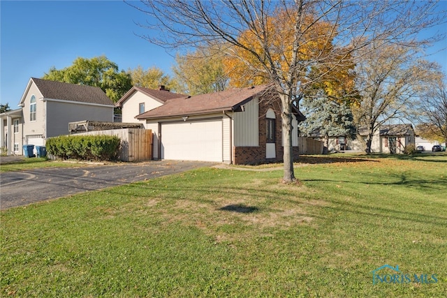 view of property exterior featuring a garage and a yard