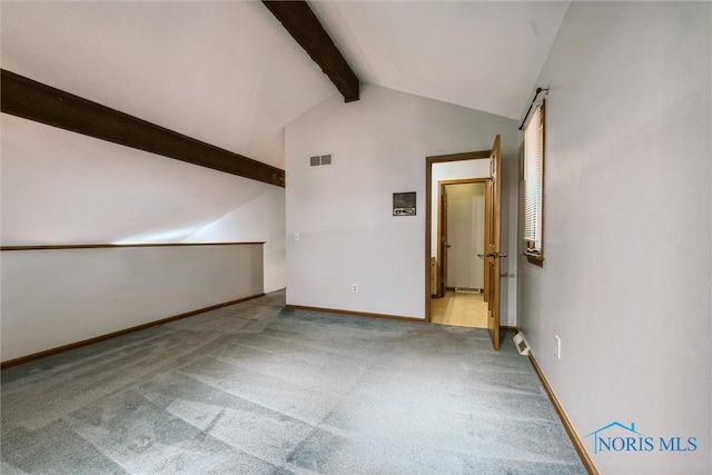 interior space featuring lofted ceiling with beams and light colored carpet