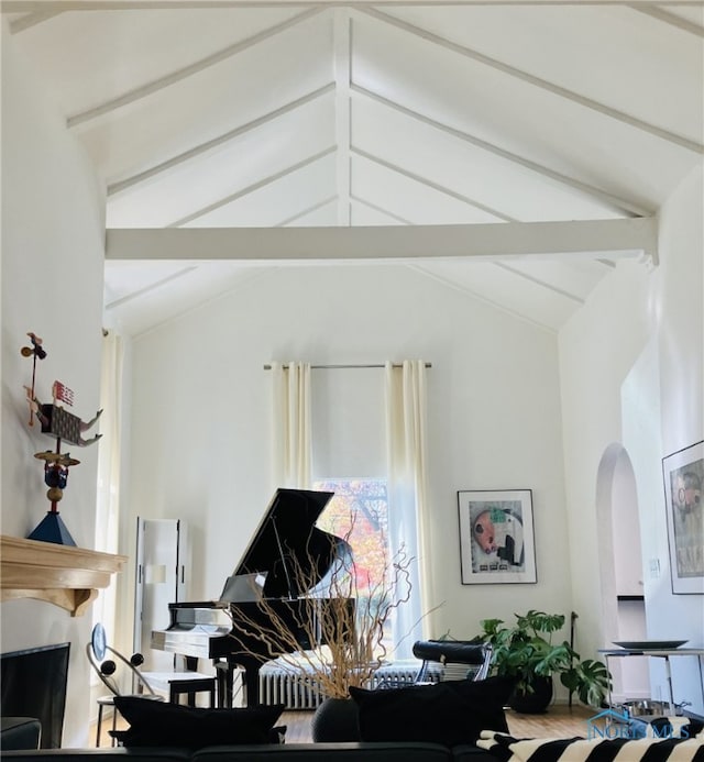 interior space with vaulted ceiling with beams