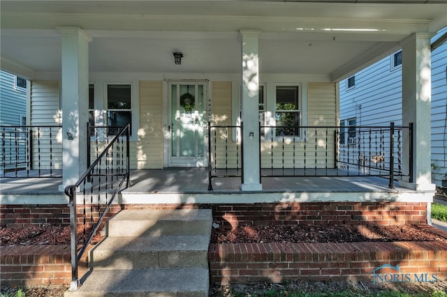 doorway to property featuring a porch