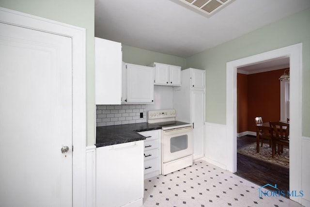 kitchen featuring decorative backsplash, white cabinetry, white electric range, and light hardwood / wood-style flooring