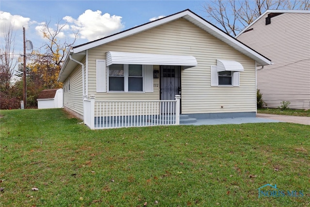 bungalow with a front lawn