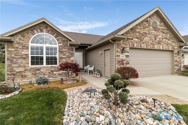 view of front of home with a garage