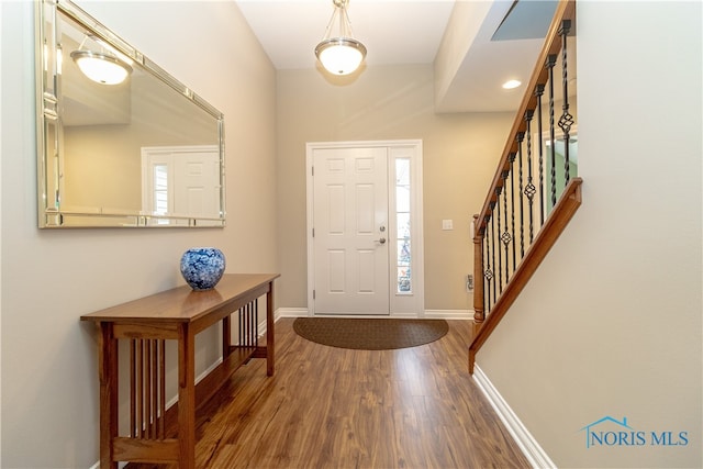 entryway with wood-type flooring